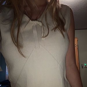 Cute and simple cream colored tank top with a bow